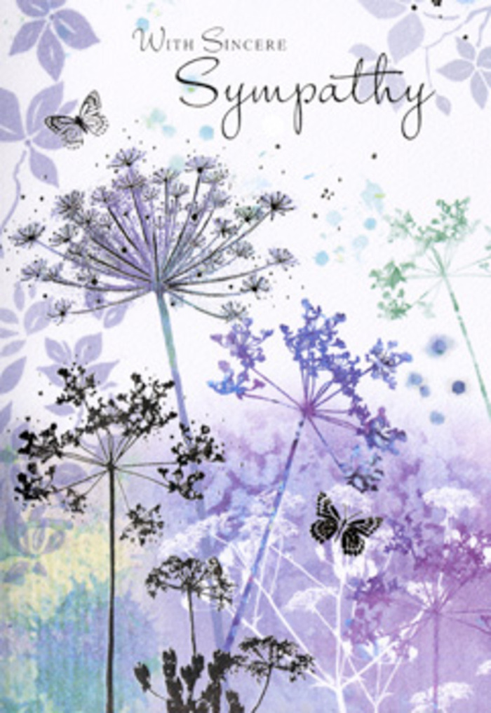 There is a contemplative quietness to this sympathy card, reminiscent of standing by the open fields near Wennington as day slowly turns to evening. The artwork focuses on tall, wispy wildflowers that rise in slender arcs from the lower edge of the scene. Their stems are fine and slightly curved, supporting rounded umbels made up of dozens of tiny, airy florets, drawn in filigree-like lines. Layers of watercolour bring them to life: cool lavender, muted violet, and soft blue tones flow into each other along the petals, while the stems and leaves carry a soft veil of silvery green. Behind them, the background dissolves into hazy washes of purple, blue-grey, and greenish mist, as though distant reeds and grasses are being blurred by a gentle, unfocused gaze. The effect evokes the look of a dewy morning when everything is softened and still. Among the slender flowers, a couple of butterflies float, their outlines faint and their wings partially transparent, catching just enough colour to link them to the surrounding blooms. They feel like quiet messengers of endurance and change, present but never overpowering. The whole composition is spacious and calm, with no overcrowding or loud detail, just the steady rhythm of repeated stems and soft bursts of floral lace. As a florist working with bereaved families in Wennington, I see in this design a sensitivity that matches the gentlest funeral arrangements - those built from soft hues and open shapes that give grief room to breathe. This card's refined palette and drifting forms offer a visual pause, a moment of still beauty in which to hold a loved one's memory.