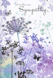 This sympathy card unfolds like a visual whisper from the quiet lanes around Wennington, where wildflowers sway gently under a pale sky. At its heart are slender, elongated stems that sway upward with a natural curve, each topped with a rounded umbrella of tiny blossoms - classic umbelliferous heads rendered in exquisite, fine-line detail. The flowers are washed in cool, calming shades of lavender, periwinkle, and soft blue, while the stems and subtle leaves hold hints of muted sage and silvery green. Behind them stretches a softly blurred backdrop, where pale violet, dove grey, and blue-green tones drift together like a low-lying mist over nearby fields. The paint seems to have been allowed to flow freely, creating feathered edges and delicate transitions that feel organic and unforced. Floating among the airy blooms are a few butterflies, sketched with light, almost transparent wings that borrow colour from the petals around them. Their gentle presence introduces a quiet sense of motion and transformation, like a comforting thought passing through sorrow. There are no sharp lines or bright highlights to jar the senses; instead, the whole image is bathed in a diffused, forgiving light that invites contemplation. From the perspective of a Wennington florist accustomed to creating understated condolence pieces, this card's design echoes the way we use soft purples and cool blues in sympathy flowers - to calm the eye and soothe the heart. It feels like an image that would rest gracefully alongside a simple funeral wreath or a vase of pastel blooms, offering a respectful, nature-inspired embrace to anyone navigating loss.